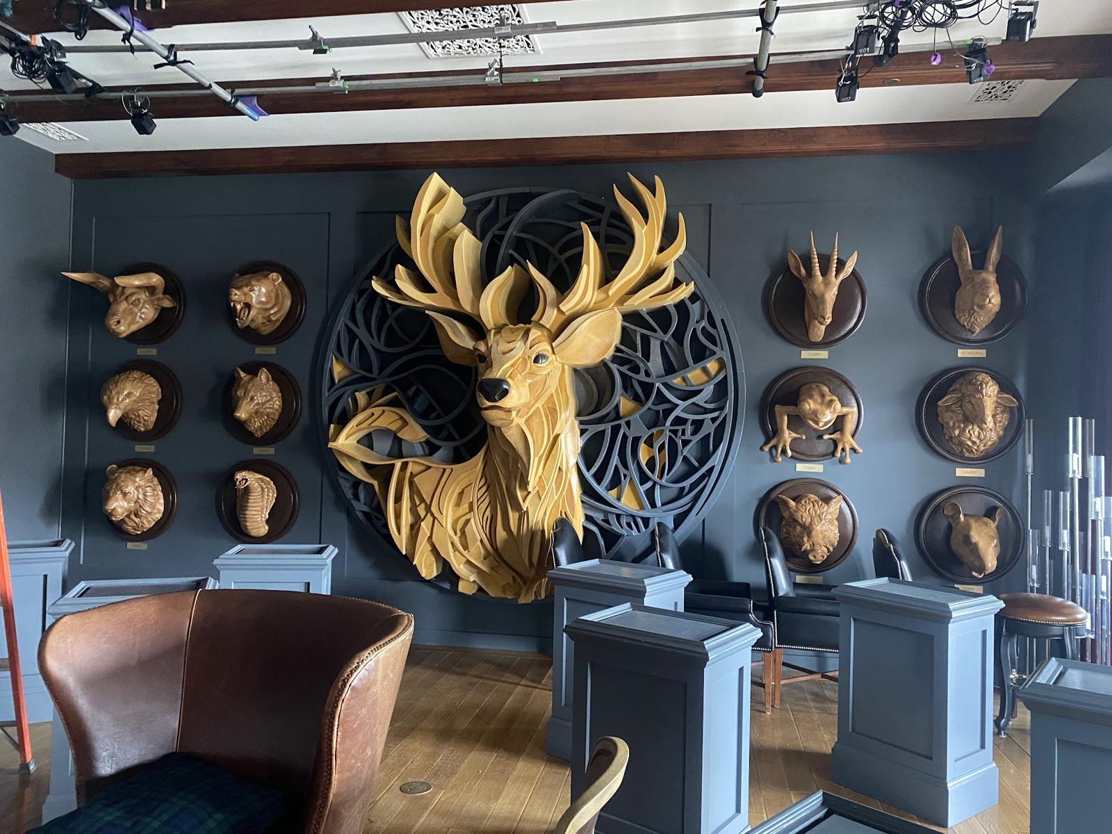 In reality — the elimination room, complete with an enormous stag