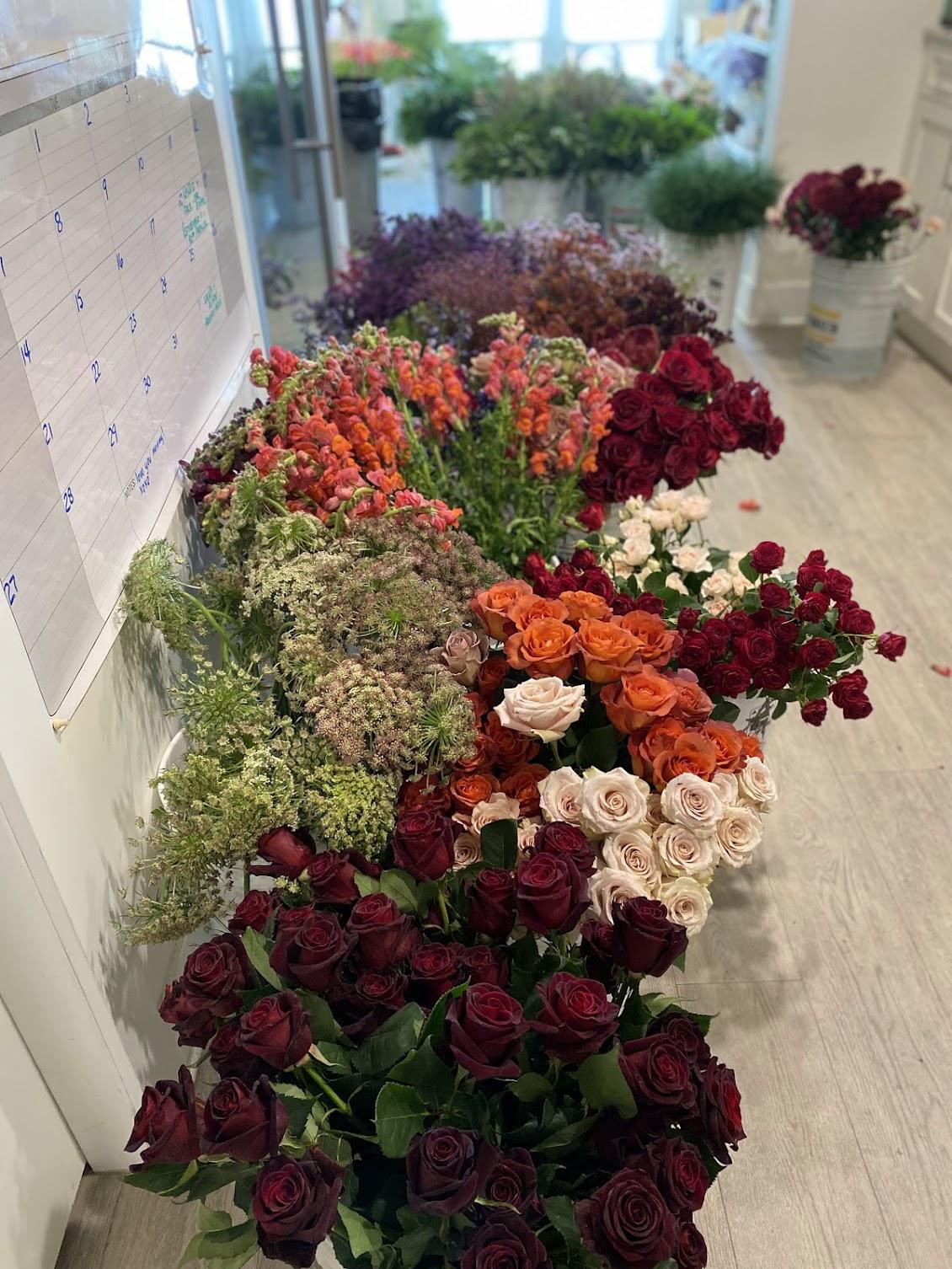 Ranunculus, peonies, and amaranthus ready for processing