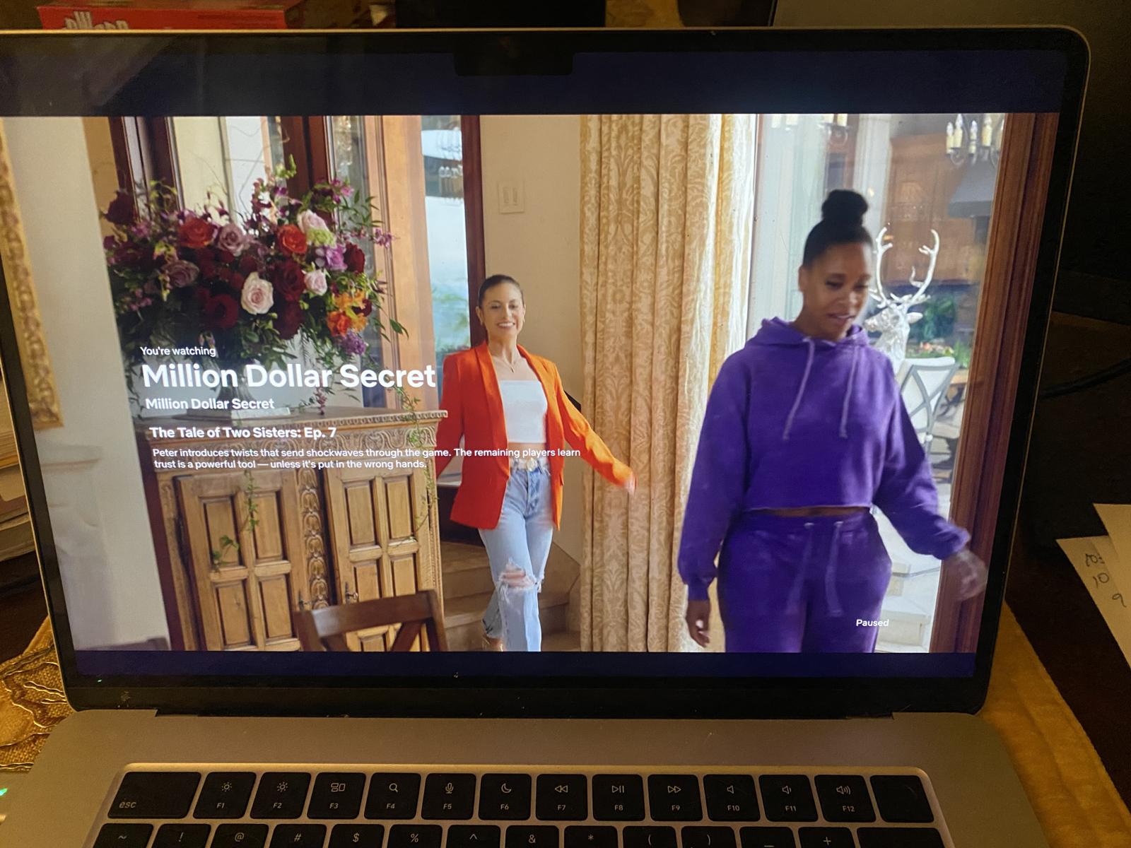 Episode 7 — contestant on set surrounded by florals