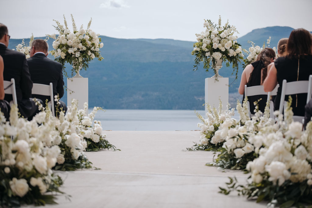 Pedestal arrangements with delphinium and peony