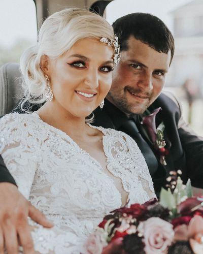Bridal bouquet, bride’s bouquet with flowers done by Sweet Elegance Floral design florist in Kelowna, BC. Dark, moody, Hollywood glam bouquet of roses, callas, astilbe, roses, dahlias in red, burgundy, purple and cream.