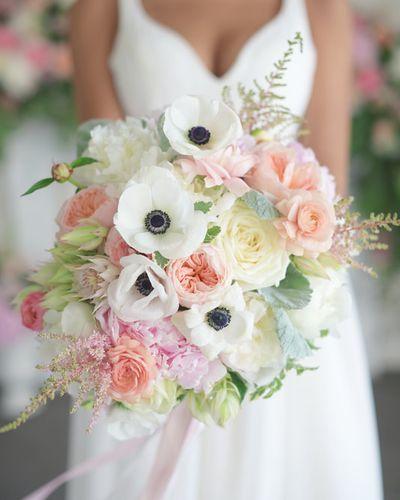 Bridal bouquet, bride’s bouquet with flowers done by Sweet Elegance Floral design florist in Kelowna, BC. Hand tied summer bouquet with anemones, garden roses, roses, astilbe and peonies in white, cream, pink, peach and purple.